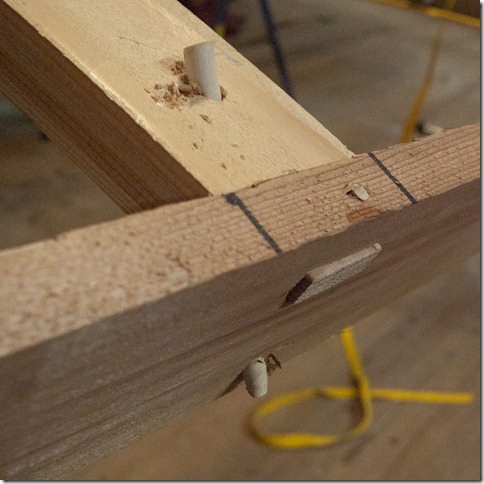 There are two pegs holding each deck rail in place.  A 1/8" through the top, and a 1/4" on a diagonal.  This is a strong joint (and no glue).